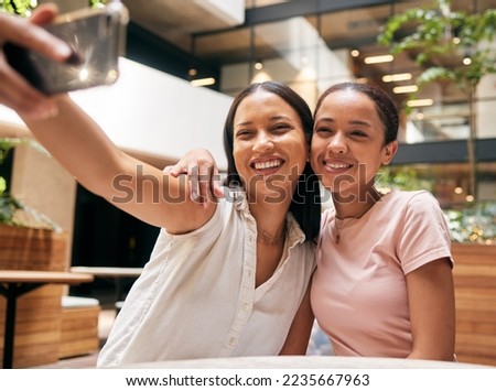 Phone, friends and women taking a selfie in restaurant for social media post, social network and memories. Friendship, smartphone and happy girls take photo enjoying quality time, freedom and weekend Royalty-Free Stock Photo #2235667963