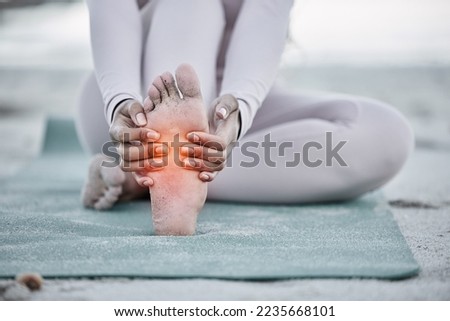 Woman, foot pain and injury at beach after yoga practice, stretching or workout for health and wellness. Sports, pilates or female massage feet, fibromyalgia or muscle tension after exercise outdoors Royalty-Free Stock Photo #2235668101