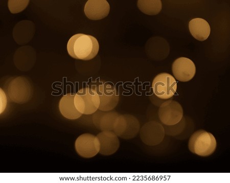 Golden and dark brown round bokeh lights festive background . High quality photo