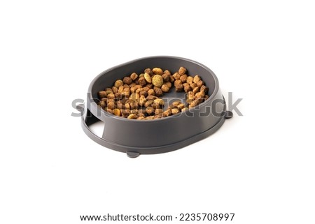 Food for cats and dogs in a bowl on a white background.	