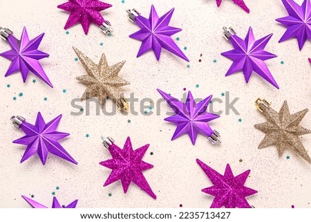 Composition with colorful Christmas decorations on light background