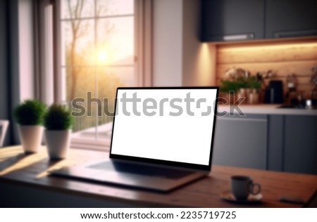 Laptop or notebook with blank screen on wooden table with blurred bokeh background in modern home window, and sunlight in the morning.
