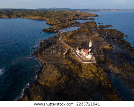 The most visited and appreciated of the island of Menorca both by visitors and photographers, images shot with drone. The Favarix lighthouse is located in the northeast of the island which makes it a 