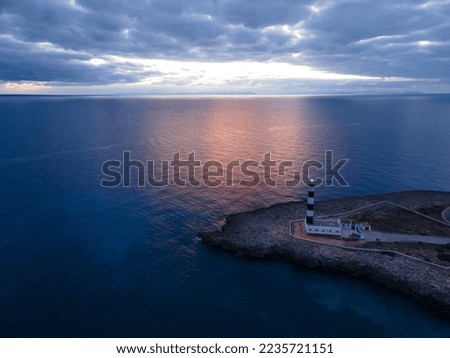 Aerial views with drone on the coast of Europe in the Balearic Islands. Different perspectives photographed with a drone at sunset, a very visited lighthouse and highly appreciated by its residents an