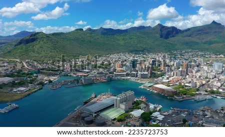 The capital of the most beautiful island in the world Mauritius from a drone. Port in the Indian Ocean with skyscrapers and turquoise water. Port Louis Royalty-Free Stock Photo #2235723753