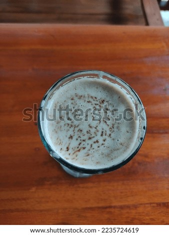 cappuccino in a glass photographed from above