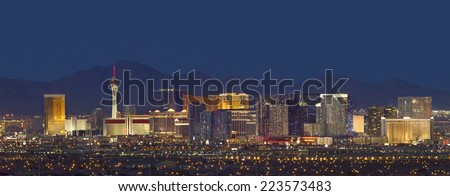 Horizontal photo of Las Vegas with mountain backdrop at night. Royalty-Free Stock Photo #223573483