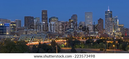 Horizontal shot of the Denver Skyline with beautiful city lights at night.