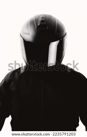 Portrait of a motorcycle rider posing with a black helmet on a white background. Royalty-Free Stock Photo #2235791203
