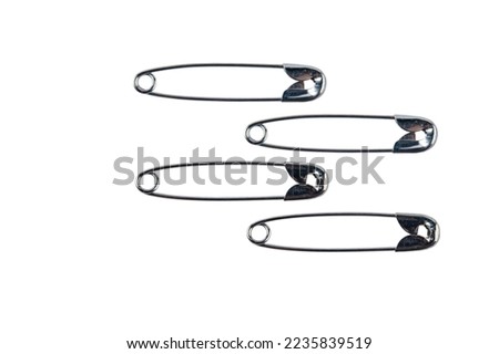 metal safety pins isolated on white background, Close up