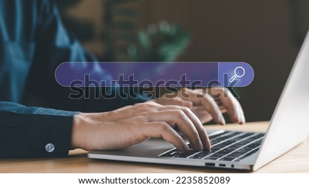 Internet search concept, man hand typing on laptops to searching information or job via internet technology. Data communication world wide connection. Royalty-Free Stock Photo #2235852089