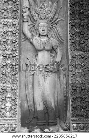 apsaras sandstone bas-reliefs at the temple in Thailand
