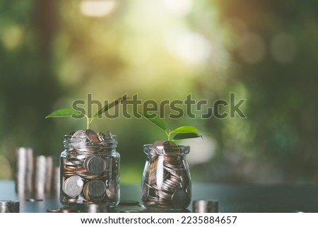 financial growth and investment ideas With new ideas, income generation and planning management for safe and achievable retirement goals, Coins in a glass jar, saving money for the future Royalty-Free Stock Photo #2235884657