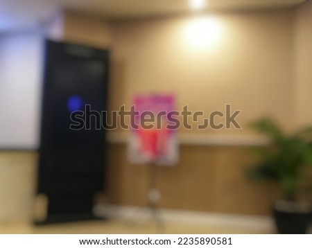 Abstract Blurred image, corner interior inside lobby of movie theater or cinema.