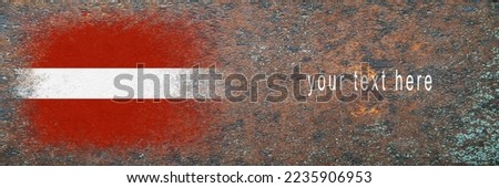 Flag of Latvia. Flag painted on rusty surface. Rusty background. Copy space. Textured creative background