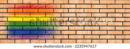Flag of LGBT. Flag painted on a brick wall. Brick background. Copy space. Textured creative background