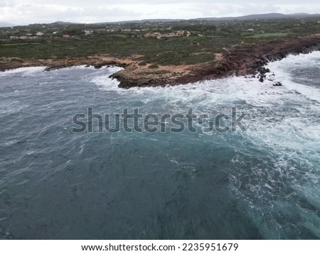 Aerial view of a stormy sea and a leaden sky with the waves breaking on the coast