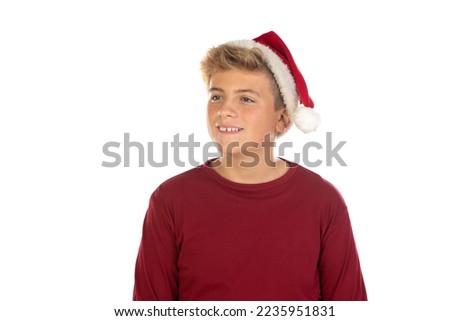 Christmas teen boy in Santa red hat isolated on white background. Happy xmas and New Year. 