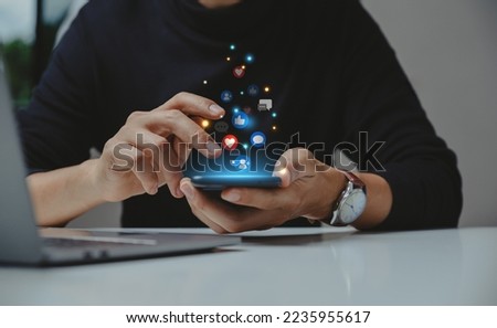 Hand of young business using smartphone, Social media concept Royalty-Free Stock Photo #2235955617