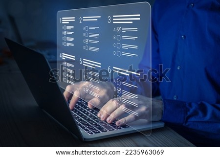 Online test, assessment or academic exam and answer multiple choice questions on computer screen. E-learning, remote student, survey, questionnaire, quiz on internet. MCQ. Person working on laptop. Royalty-Free Stock Photo #2235963069