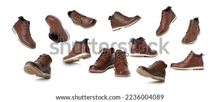 Brown leather boots, Men’s brown ankle boots in different angles and positions. Isolated on white background Royalty-Free Stock Photo #2236004089