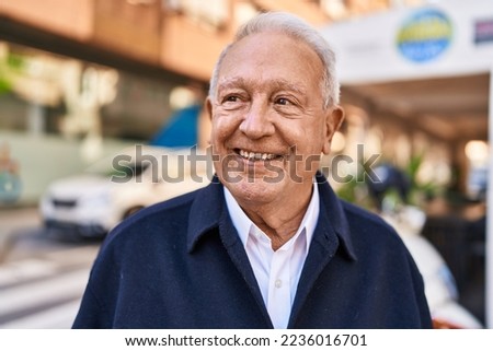 Senior man smiling confident standing at street