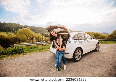 Road trip with son. Woman with a child in summer clothes in the mountains. Couple of mother with her son on vacation. Single mom on vacation with his boy. Road trip with child	