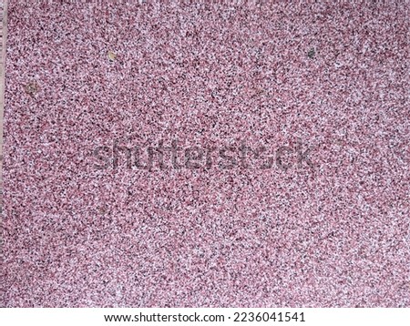
pink polka dot tiles on the floor