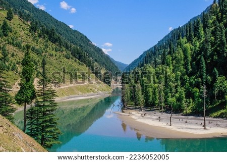 Picture of Mountain, Trees, River and Stream of adjoining areas of Kashmir. In this picture you can see the hill view along with stream and trees with beautiful scene of greenery on mountains Royalty-Free Stock Photo #2236052005
