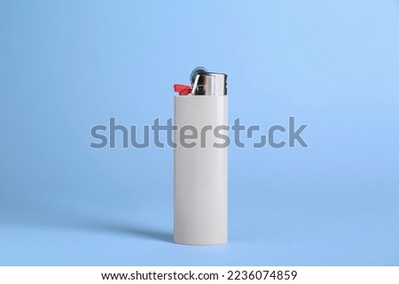 Stylish small pocket lighter on white background Royalty-Free Stock Photo #2236074859