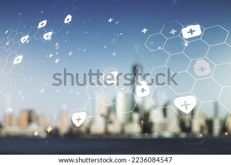 Double exposure of abstract virtual medical hologram on blurry cityscape background. Healthcare technolody concept