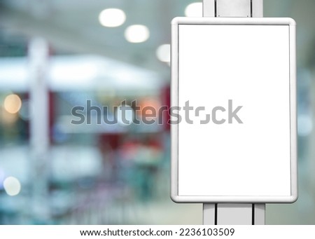 Blank advertising board in shopping mall. Mockup for design