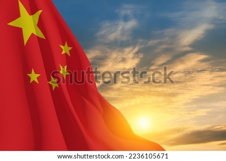 Close up waving flag of China on background of sunset sky. Flag symbols of China. National day of the people's republic of China. 1st October.
