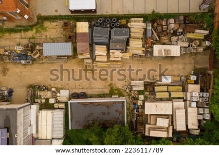 Drone photography of construction storage yard during summer day