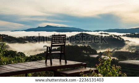 Early morning on the mountain in Da Lat, Vietnam. Cloud is flowing between mountains creating a peaceful scenery. Royalty-Free Stock Photo #2236131403