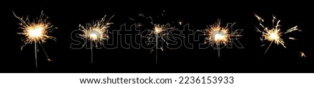 Collage with bright burning sparklers on black background, banner design Royalty-Free Stock Photo #2236153933