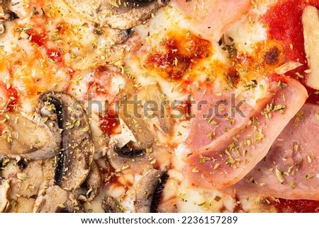 Homemade pizza with ham and mushrooms as a background. A close shot of a pizza. Macro photo.Italian pizza capricciosa. Close-up