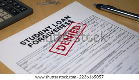 A closeup view of a student loan application getting denied. Data on form is fictional.	 Royalty-Free Stock Photo #2236165057