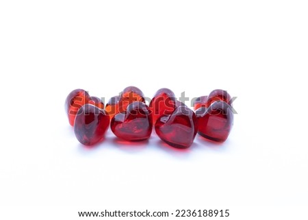 8 red glass hearts on white background1