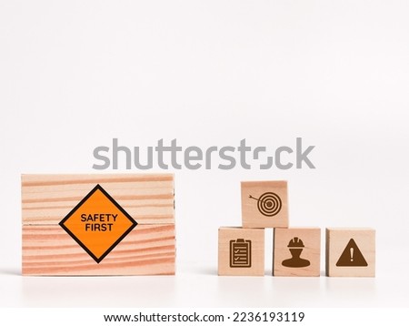 Zero accident concept on wooden blocks with icons against white background.