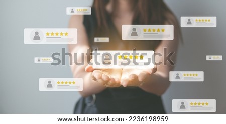 Customer review good rating concept, hand pressing user and five star icon on visual screen for positive customer feedback, testimonial and testimony, user comment and feedback for review. Royalty-Free Stock Photo #2236198959