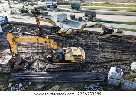 Several powerful excavators are working on the construction site. view from above. drone photography. Earthworks with heavy equipment at the construction site