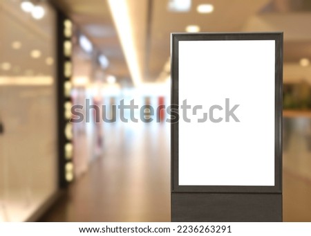 Blank advertising board in shopping mall. Mockup for design