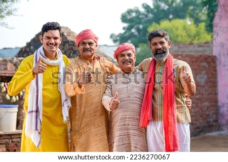 Indian farmers or villagers group showing thumps up Royalty-Free Stock Photo #2236270067
