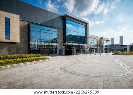 Modern business building in sunny day Royalty-Free Stock Photo #2236275389