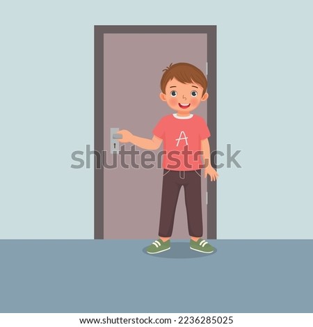 Cute little boy closing the door