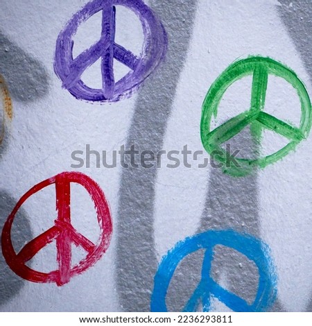 colorful peace symbols painted on a wall