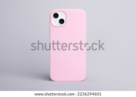 high quality starlight iPhone 14 Plus pink phone case mock up, smartphone isolated on gray background back view Royalty-Free Stock Photo #2236294601