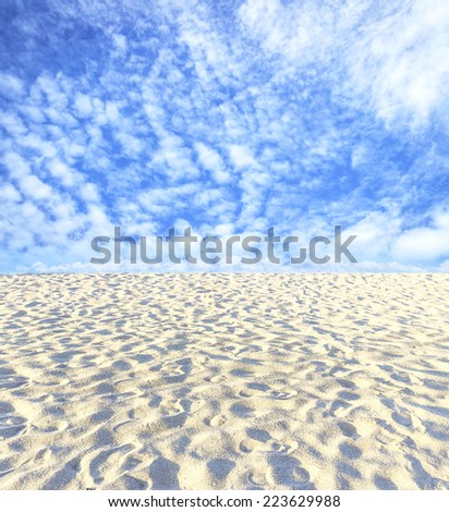 Abstract sand and blue sky.