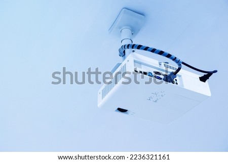 Multimedia projector installed on ceiling